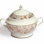 The 3 litre porcelain toureen comes with a cover and is adorned with a city in gold print, inspired from a city in an Arab country, and is a commissioned art work from the artist Lizzie Cullen.