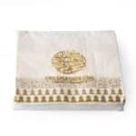 "Printed napkins, with gold design and Arabic calligraphy on its border. The verse is written by the poet Al Mutanabi describing how people's true selves is shown in how generous they are. عَلى قَدرِ أَهلِ العَزمِ تَأتي العَزائِمُ
وَتَأتي عَلى قَدرِ الكِرامِ المَكارِم.  Napkin size 33x33cm when open, 3ply tissue, 20 napkins per pack."